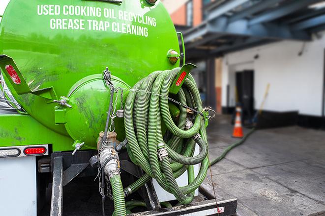 large truck pumping grease trap at a restaurant in Liberty SC